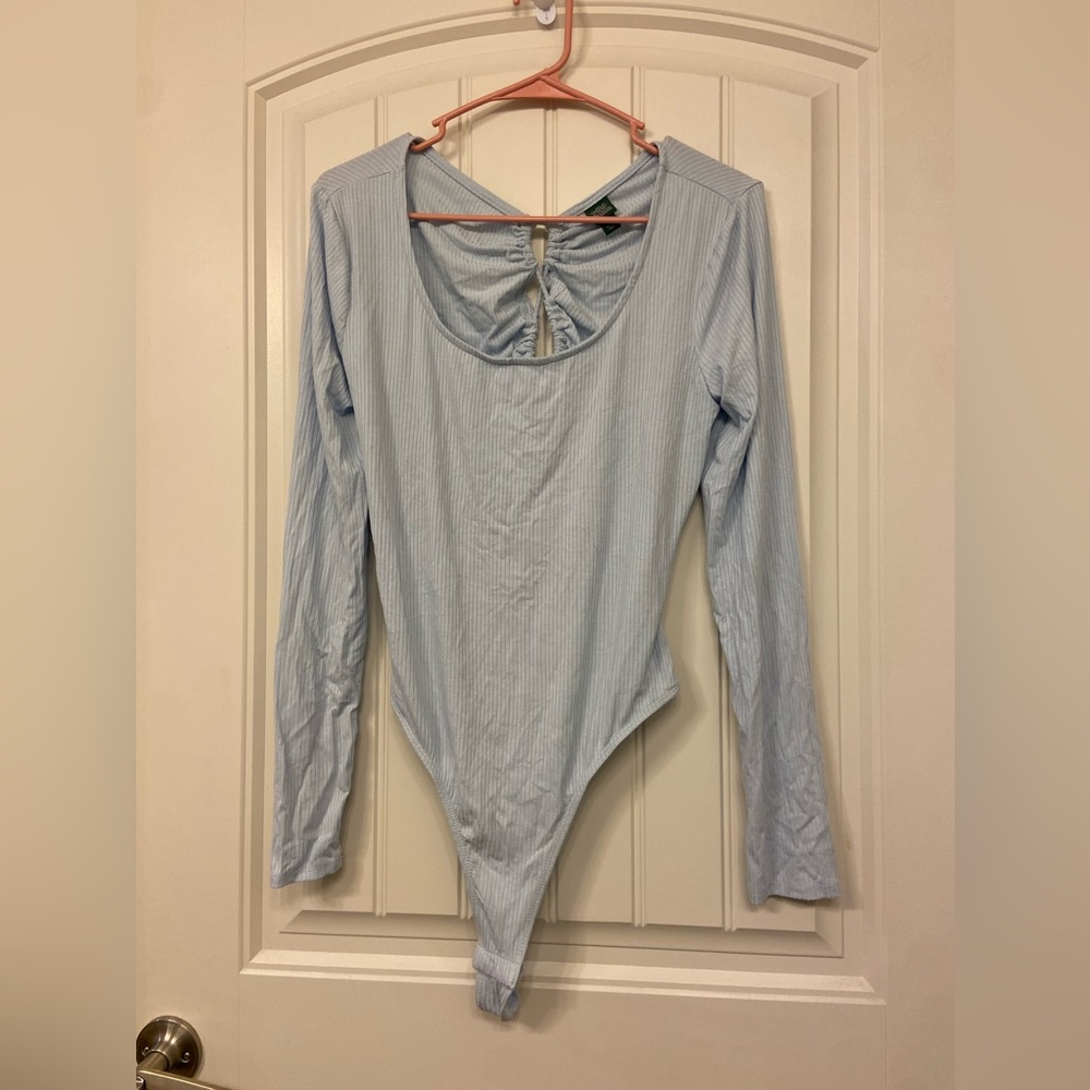 Cross back open body suit